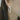 Close-up of a person wearing diamond hoop earrings with blurred background