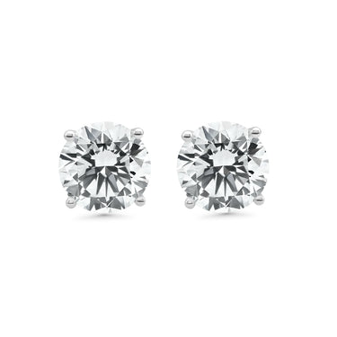 Pair of diamond stud earrings on a white background