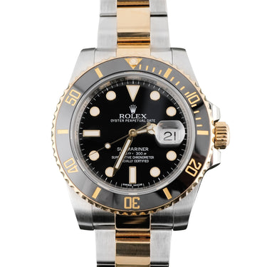 Two Tone Gold and silver Rolex Submariner Date 40 mm watch with Black Dial on a white background