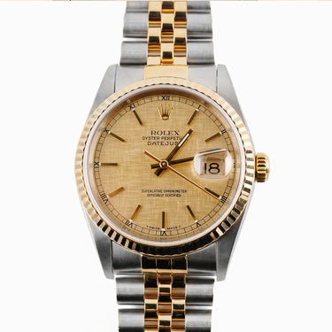 Two-tone gold and silver Rolex Datejust 36 mm watch with a Fluted Bezel, Champagne Linen Dial, and Jubilee Bracelet on a white background