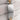 Close-up of a silver and gold Rolex watch band with Rolex logo on a light fabric background