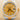 Rolex watch with gold face and silver case on a beige background