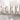 Close-up of a silver watch band on a white background