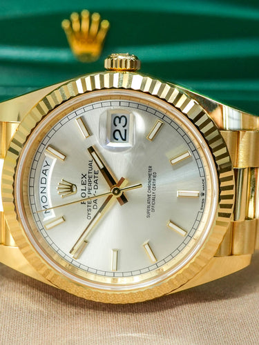 yellow gold Rolex date-date watch