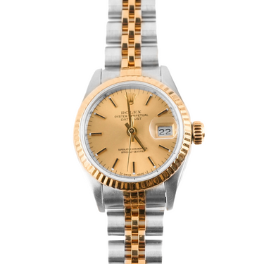 Two-tone gold and silver watch with a gold face on a white background