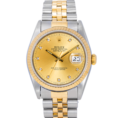 Two-tone gold and silver watch with a gold face on a white background