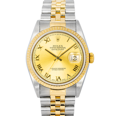 Two-tone gold and silver watch with a gold face on a white background