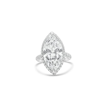 Diamond ring with a marquise-shaped center stone on a white background