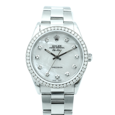 Silver Rolex watch with diamond-studded face on a white background