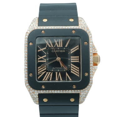 Cartier watch with black strap and diamond-studded case on a white background