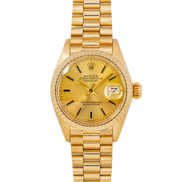 Gold Rolex watch on a white background