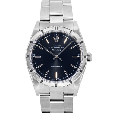 Silver watch with a black dial on a white background