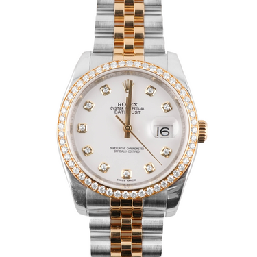 Two-tone watch with diamond-studded face on a white background