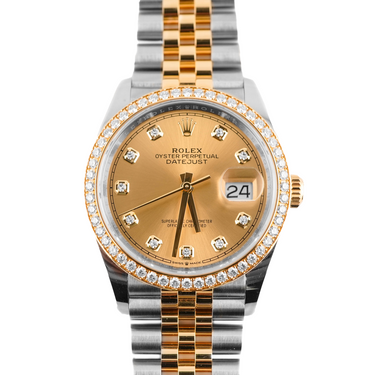Luxury watch with gold and silver band on a white background