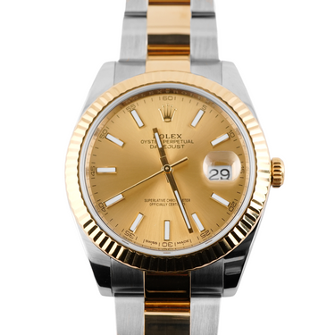 Two-tone gold and silver watch with a gold face on a white background