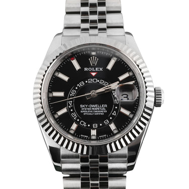 Silver Rolex sky-dweller watch with black dial on a white background