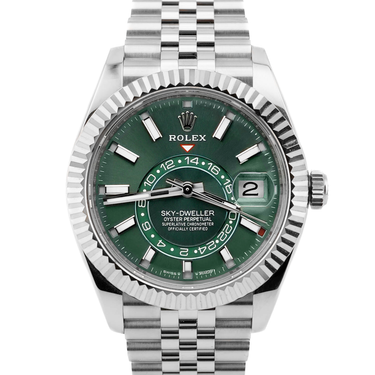 Rolex watch with green face and silver metal bracelet on white background