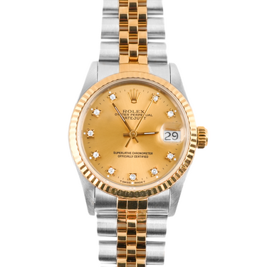 Gold and silver watch with a white background