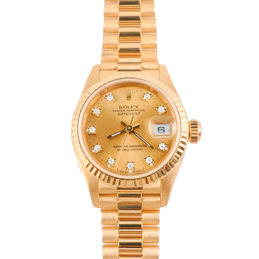 Gold Rolex watch with diamond-studded face on a white background