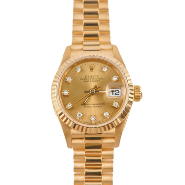 Gold Rolex watch with diamond-studded face on a white background