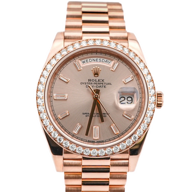 Rose gold Rolex watch with diamond bezel on a white background