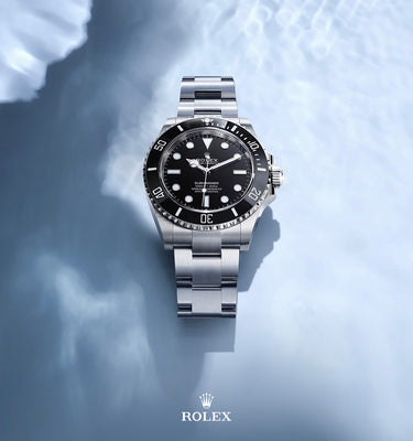 Rolex watch on a light blue background