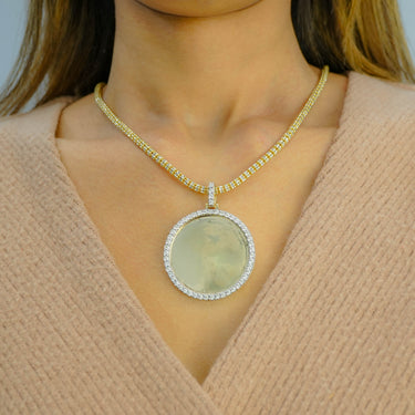 Shop the 10K yellow gold diamond picture pendant featuring 0.94 CT of diamonds. A bold and personal statement piece, available now at Ecijewelers.