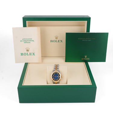 Rolex watch in a green box with a white background