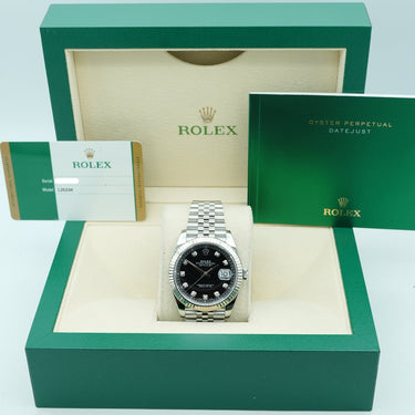 Rolex watch in a green box on a light blue background