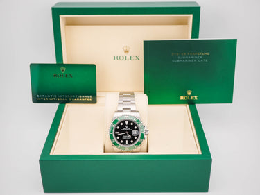 Rolex watch in a green box with a white background