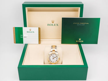 Rolex watch in a green box with a white background