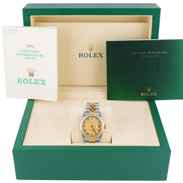 Rolex watch in a green box with the Rolex logo visible