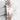 Two-tone Rolex watch with rose gold and silver band on a light gray background