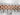 Close-up of a rose gold and silver Rolex watch band on a textured white background