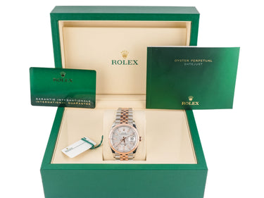 Rolex watch in a green box with a white background