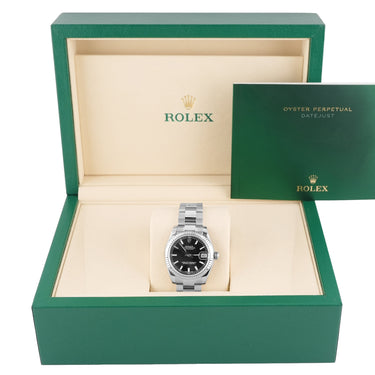 Rolex watch in an open green box on a white background