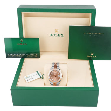 Rolex watch in a green box with a white background