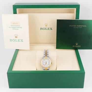 Rolex watch in a green box with the Rolex logo visible