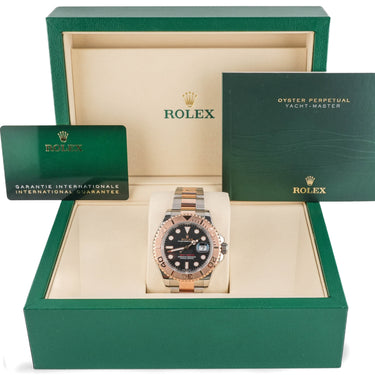 Rolex watch in a green box with the brand logo visible
