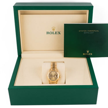 Gold watch in a green Rolex box on a white background