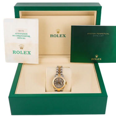 Rolex watch in a green box with a white background