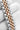 Close-up of a silver and rose gold watch bracelet on a white background