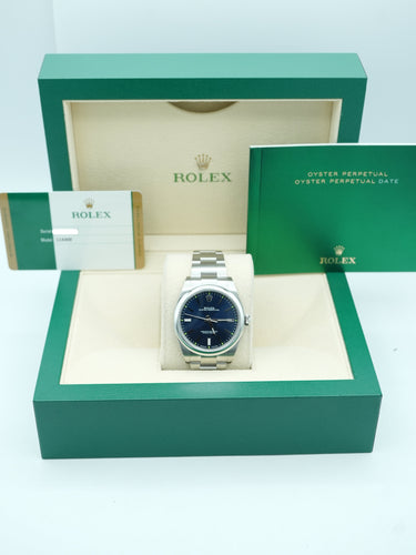Rolex 114300 Oyster Perpetual 39 mm Smooth Bezel Blue Dial Oyster Bracelet Complete Set 2015