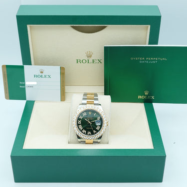 Rolex watch in a green box with a white interior