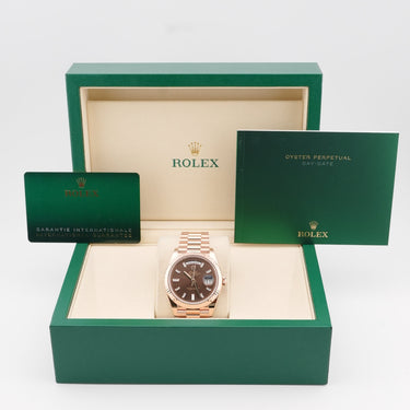 Rolex 228235 Day-Date 40 mm 18K Rose Gold Chocolate Dial Presidential Bracelet Complete Set 2025 on a white background