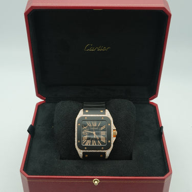 Cartier watch in a red and black box on a white background