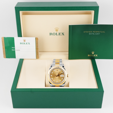 Rolex watch in a green box with a white background