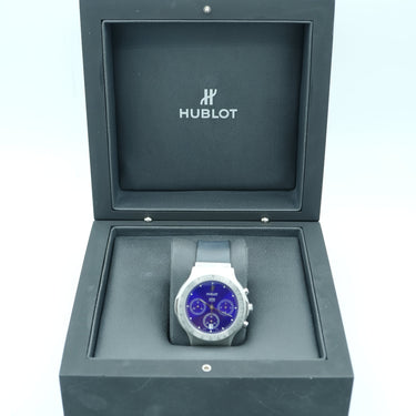 Watch in a gray display case with 'Hobbs' branding on a white background