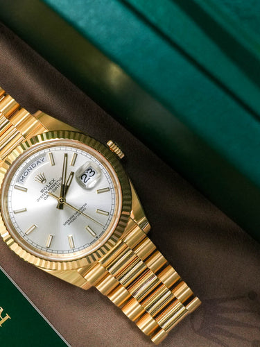 yellow gold Rolex watch