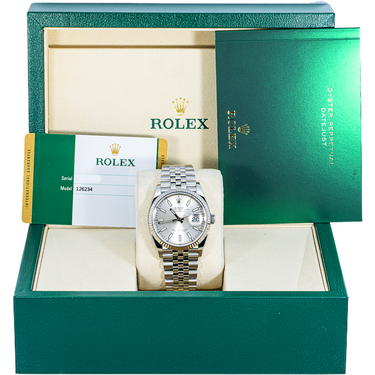 Rolex watch in a green box with a white interior